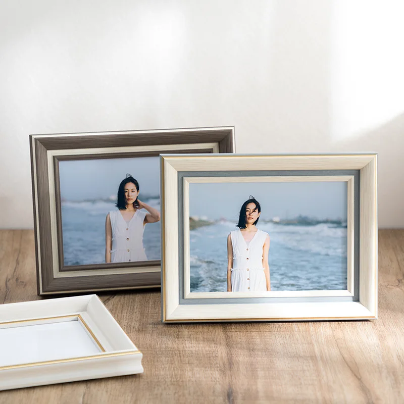 https://ae01.alicdn.com/kf/Sc0a30559a4a648b2984e1dfd786a7582R/4-color-European-style-Simple-Creative-Photo-Frame-Table-5-6-Inch-7-8-10-Inch.jpg