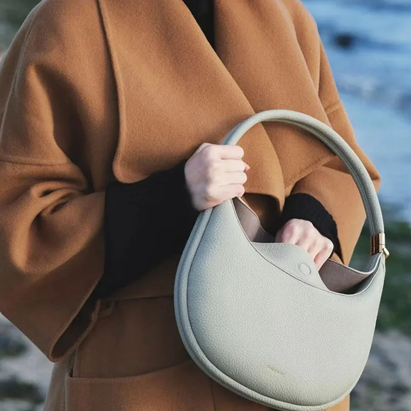 Songmont Halbmond Tasche Serie Mond geformte Tasche Persönlichkeit Design Herbst und Winter neues Produkt Schulter Achsel Luna Taschen