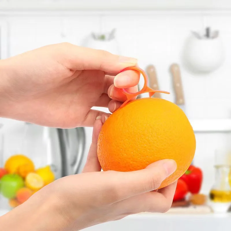 https://ae01.alicdn.com/kf/Sc0f4b5a2729a447987aadcc09985f5e6r/1pc-Ring-Orange-Peeler-Kitchen-Gadgets-Cooking-Tools-Peeler-Parer-Finger-Type-Open-Orange-Peel-Orange.jpg