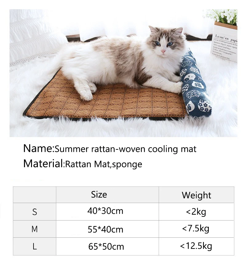 A cat lounges on the KittyNook Cat Co. Natural Rattan Cat Sleeping Mat with a blue bolster, near its size chart.
