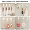 Four-piece traceless adhesive hooks. They are perfect for hanging keys on the doors and walls of kitchens and bathrooms. 6