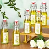 Swing Top Glass Bottles for Olive Oil Homemade 8 oz Clear Flip Top Bottles with Airtight Lids Labels for Storing Homemade Oil 3