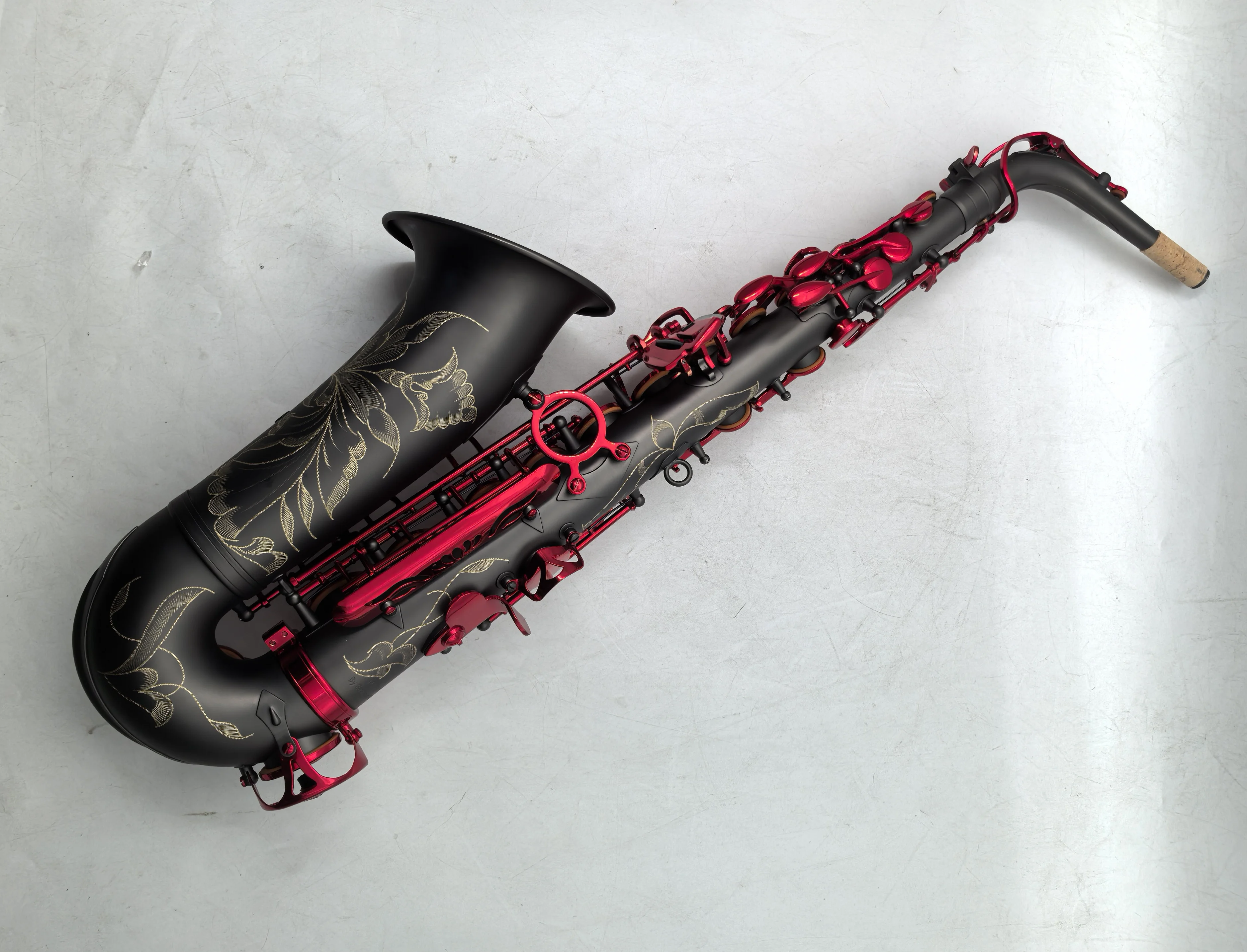 The Imperium matte black nickel plated Alto Saxophone with red lacquer keys