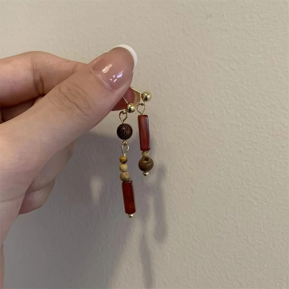 

New Chinese style retro trend asymmetrical red beaded earrings 925 silver needle cold wind sense earrings female