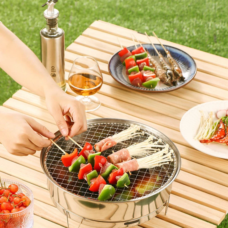 https://ae01.alicdn.com/kf/Sc2548b0c927144278247c6b2fabb1a50o/Stainless-Steel-Round-BBQ-Grill-Outdoor-Picnic-Portable-Kebab-Grill-Iron-Nets-Barbecue-Small-Charcoal-Grill.jpg