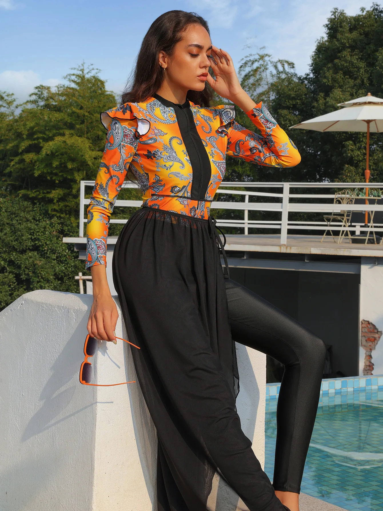 Flat lay display of modest Muslim swimsuit showing all three pieces separately