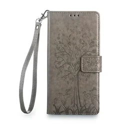 Elegante leren flipcover met boom- en hertmotief, met kaartsleuven en geldclip