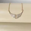 Collier pendentif ailes d'ange en or brillant, luxueux et exquis, entièrement serti de zircon, pour femmes, accessoires de bijoux de créateur de mode