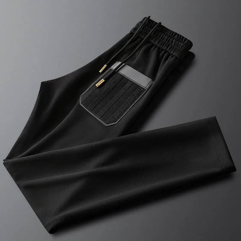 

Light luxury Autumn black elasticated slacks men's slim stretch small straight cylinder embosser men's lace-up sports pants