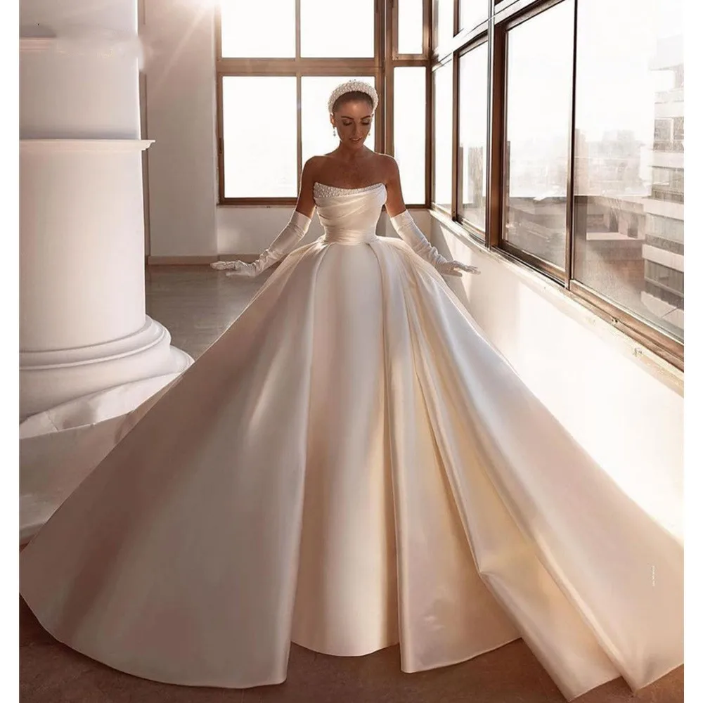

Luxurious Dubai Arabic Wedding Dresses For Women Strapless Sleeveless With Pearls Big Bow Long Train Bridal Gown Robe De Mariée