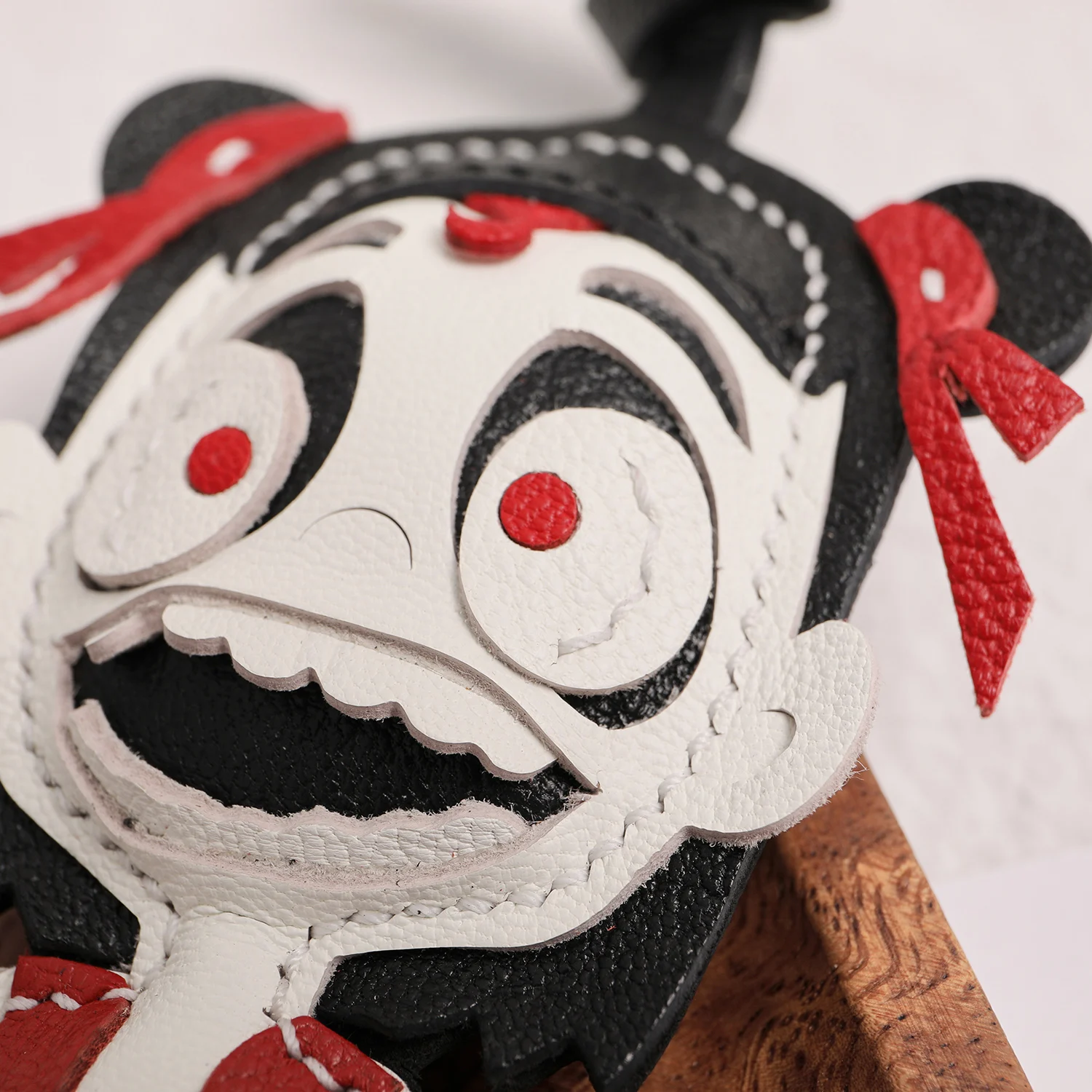 Artisan leather character keychain close up