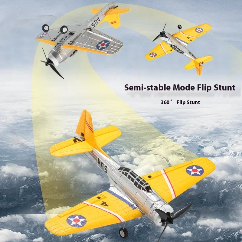 Planeur RC moteur brushless posé sur herbe, portée 100m indiquée sur la boîte.