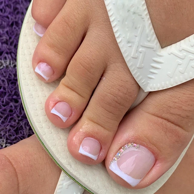 Female Feet with White Nail Polish. Woman Legs with White Nail Design on  Blue Fabric Stock Photo - Image of feets, manicure: 190414214