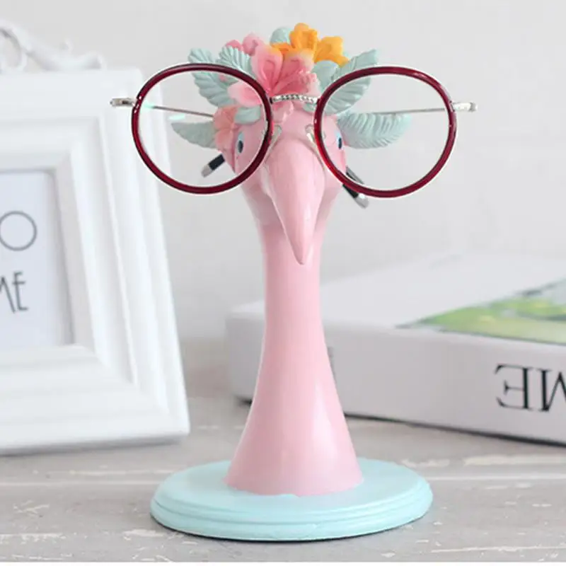 https://ae01.alicdn.com/kf/Sc2d6ef30d9dd4011a9cb10919c50ec116/Flamingo-Shaped-Resin-Eyeglass-Holder-Eyeglass-Stand-Handmade-Carved-Spectacle-Holder-Sunglasses-Display-Stand-Home-Office.jpg