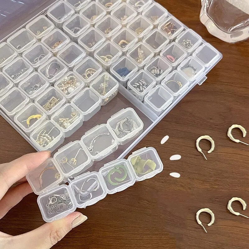 Sc2e14162b3da4d1bb7e6f88860878825R 28 Grids Plastic Jewelry Storage Box Necklace Earrings Rings Jewelry Packaging Organizer Portable Pill Medicine Storage Box Mallzona