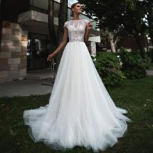 

RANMO Pastrol Wedding Dress A Line Boat Neck Cap Sleeves Pearl Court Train Garden Bridal Dress Applique Lace Church Wedding Gown
