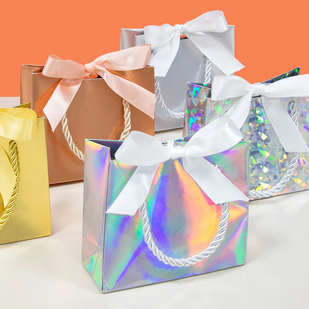 Laser gift paper bag holiday party gold and silver packaging carton ribbon small paper bag