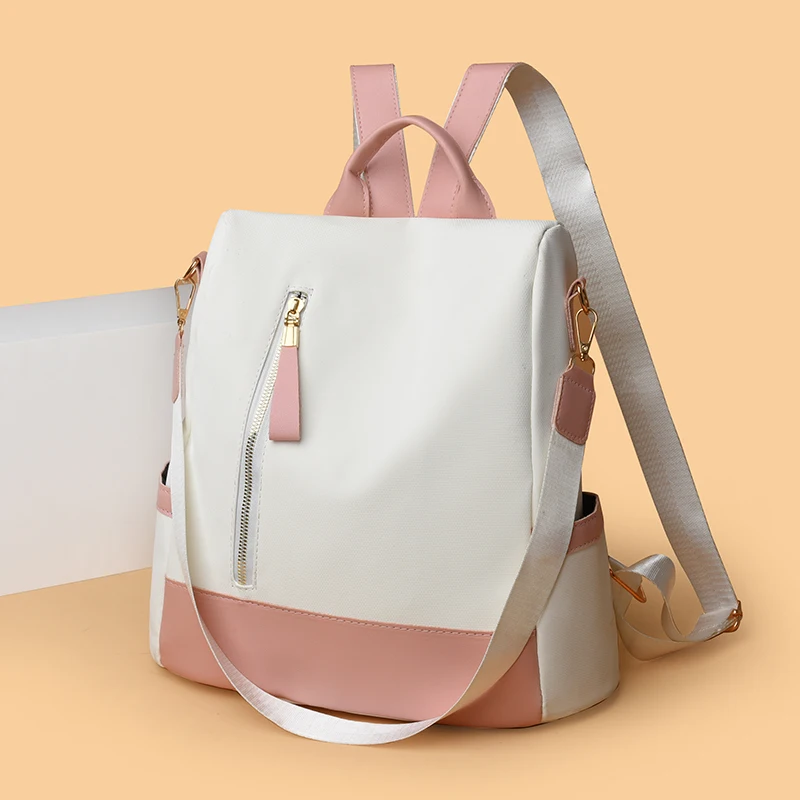 Women's travel backpack, large capacity, zipper closure, convertible shoulder bag design, perfect for school, work or travel