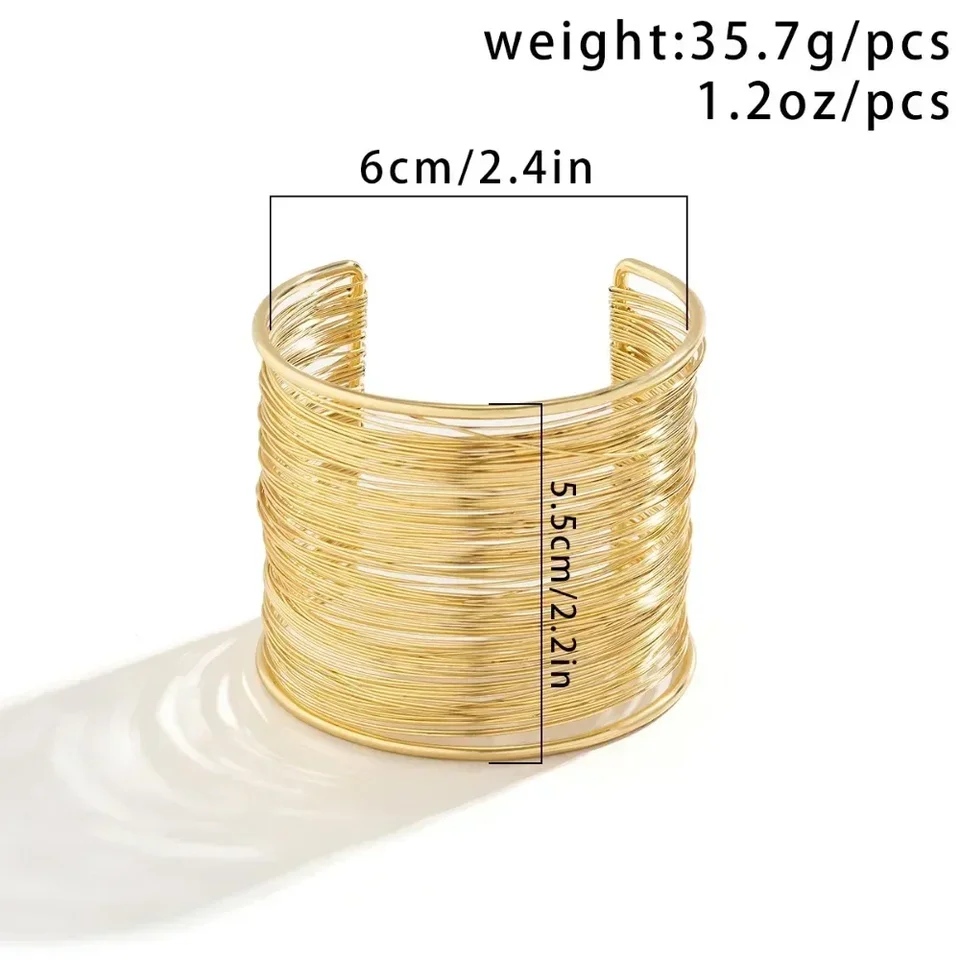 Bracciale rigido largo avvolto in filo d'oro: stile brutalista - Italia