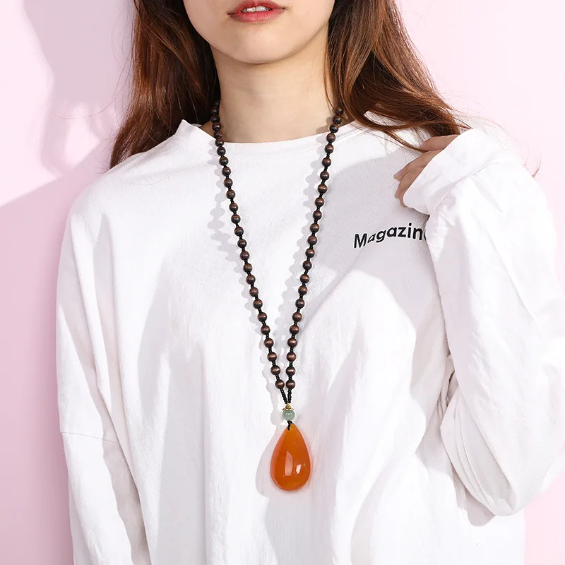 Imitation beeswax water drop necklace nuclear wood beads long sweater chain women's imitation amber pendant