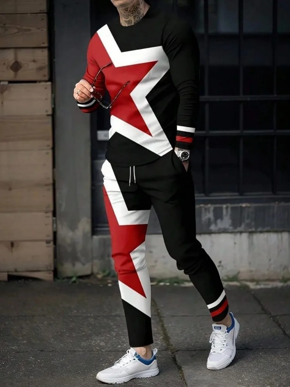 Man wearing striped patchwork long sleeve top and pants set in a sunny outdoor setting star