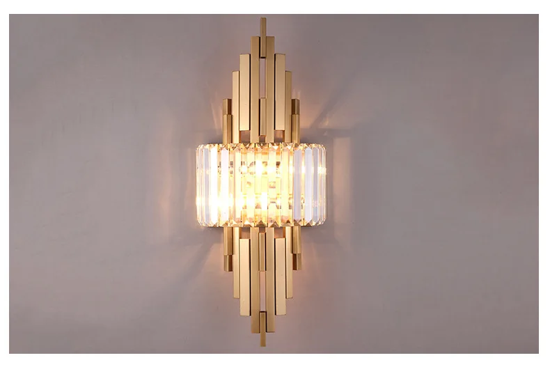 The Luxury Geometric Wall Sconce, featuring gold metal accents and multiple transparent glass elements, casts an elegant glow against a neutral background, making it ideal for elevating your sophisticated home decor.