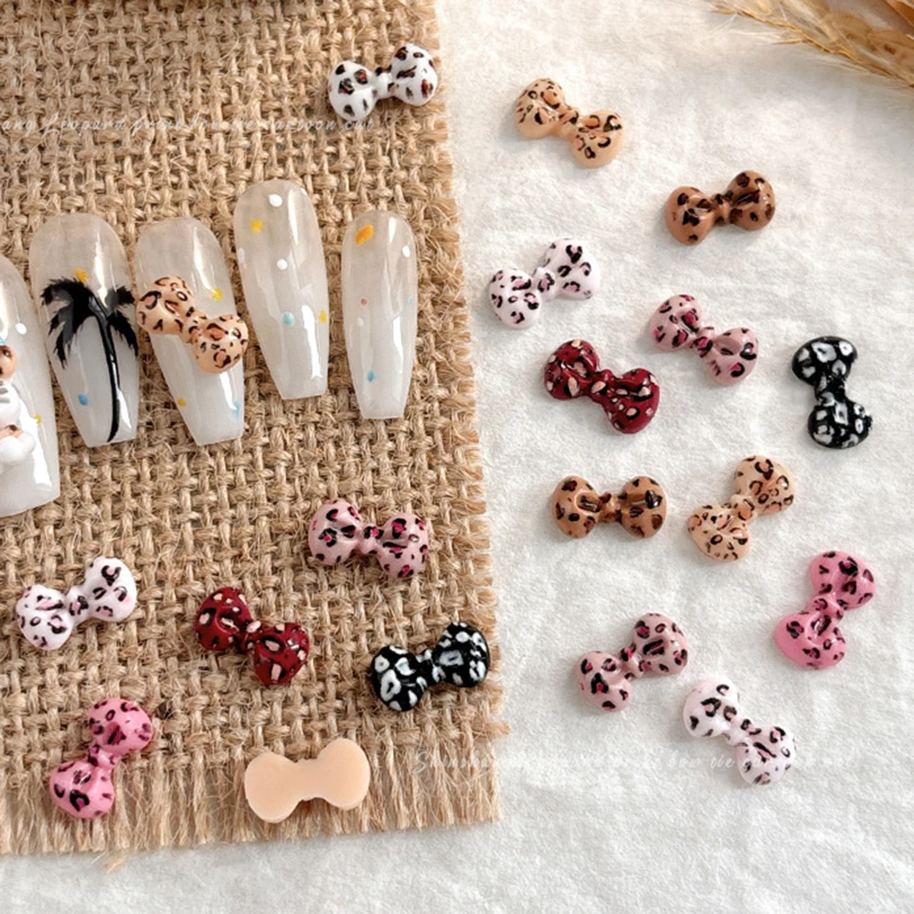50pcs 믹스 레오파드 보우 네일 매력 매니큐어에 대 한 Bowknot 수 지 네일 아트 라인 석 DIY 장식 사랑스러운 컬러 레오파드 매력