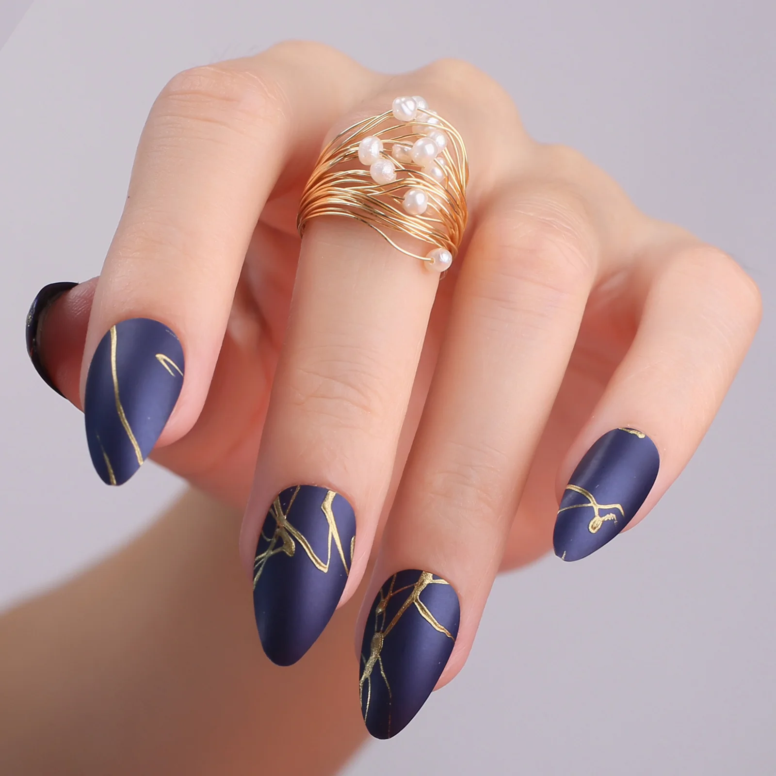 Elegant Deep Blue Nails with Gold Accents