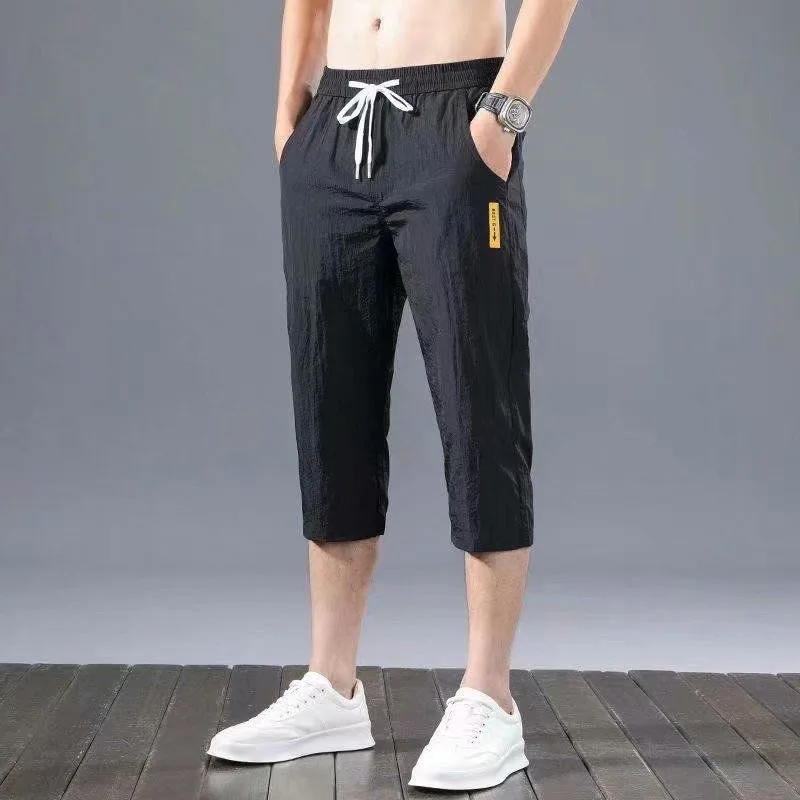 Men Solid Color Elastic Waist Summer Men Breathable Motion Casual Korean Ice Shreds Trend Thin Style Loose Large Size Pants