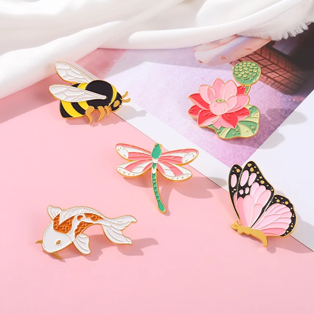 Pin it on you: 16 brooches, badges and stick pins to add instant