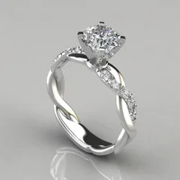 Popular and Elegant Princess-cut diamond ring with twisted braid and modern design.