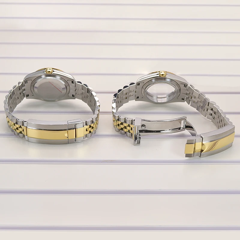 Elegant Gold and Silver Fluted Watch Case with Sapphire Glass