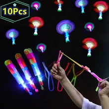 10 szt. Świecąca na zewnątrz rakieta katapulta lampa błyskowa LED świecący w nocy dzieci zabawki proca elastyczna helikopter obracająca zabawka dla dzieci