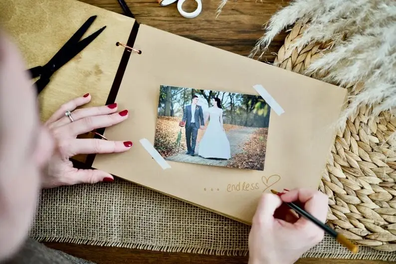 Elegant guest book made of wood for the wedding photo album dried flowers photo book