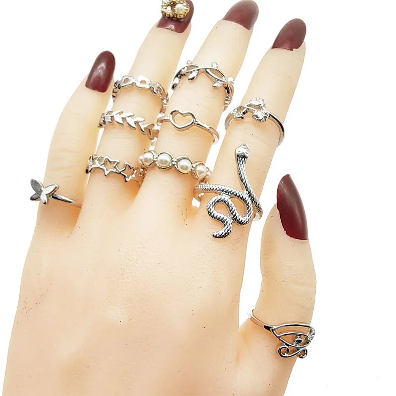 Close-up on pearl inlay detail on gold colored rings