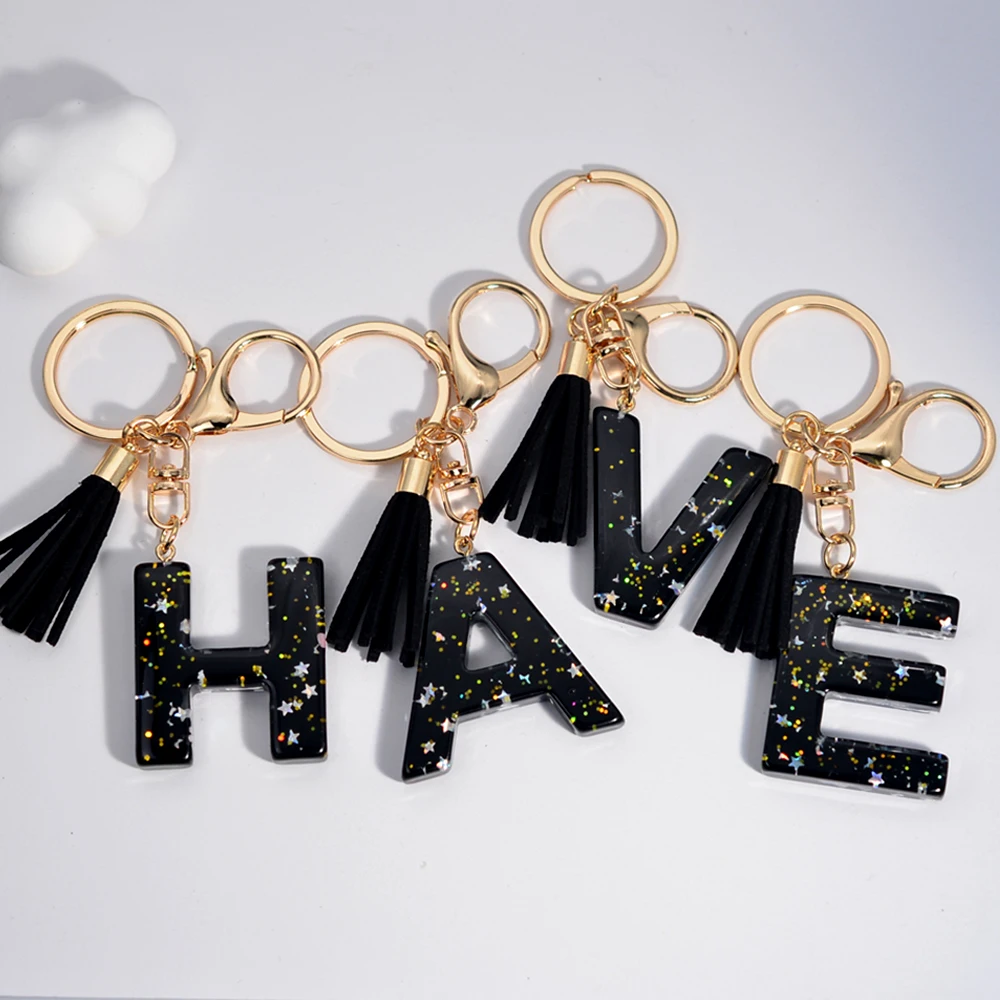 https://ae01.alicdn.com/kf/Sc6cb422afe6c4d188c90e9a71005358aJ/Shiny-Black-26-Letter-Keychain-A-Z-Initial-Star-Sequin-Filling-Keyring-Black-Tassels-Pendant-Car.jpg