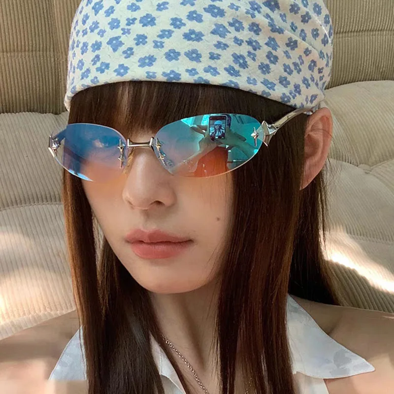 Y2K rimless elliptical fashion sunglasses with tinted lenses