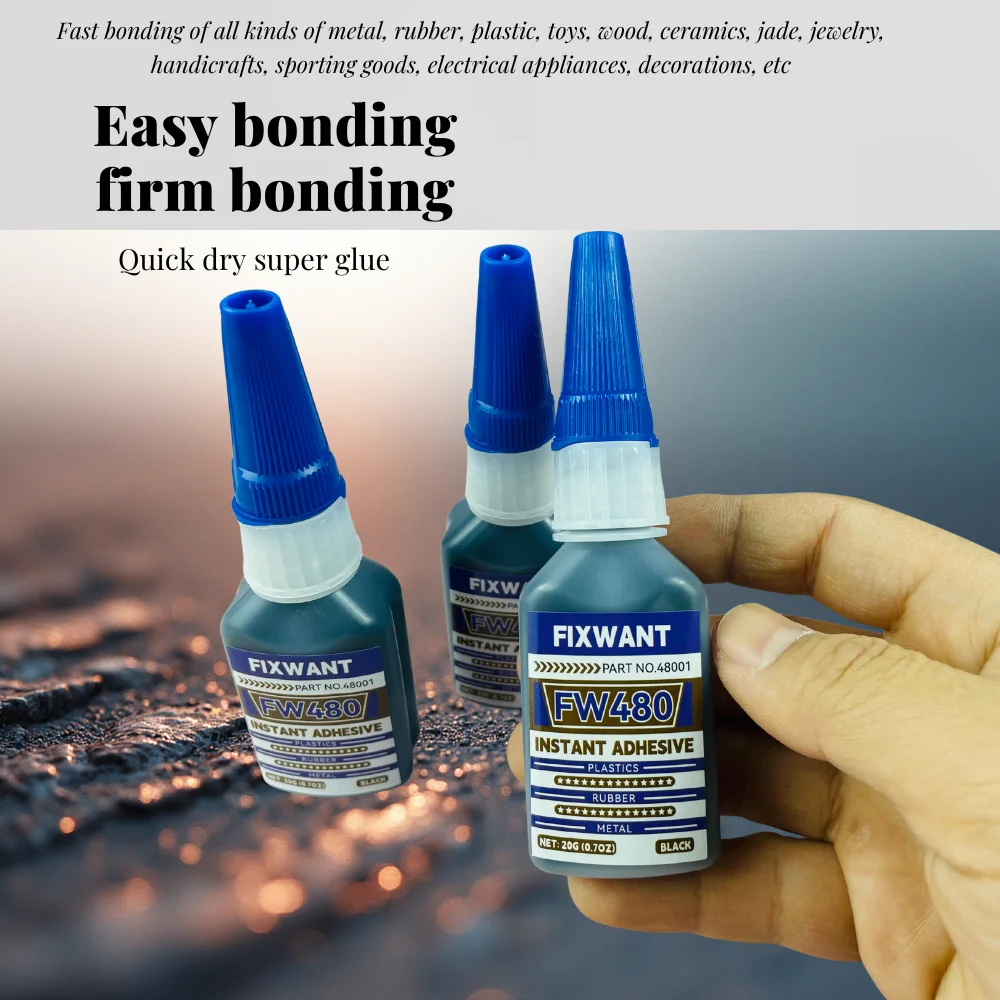 Gros plan sur une goutte de peinture acrylique pour maquettes, texture lisse et brillante, pinceau à côté.