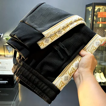 Pantaloni casual di lusso leggeri Pantaloni sportivi stampati lavorati a maglia con ricamo di fascia alta alla moda autunno e inverno da uomo 1
