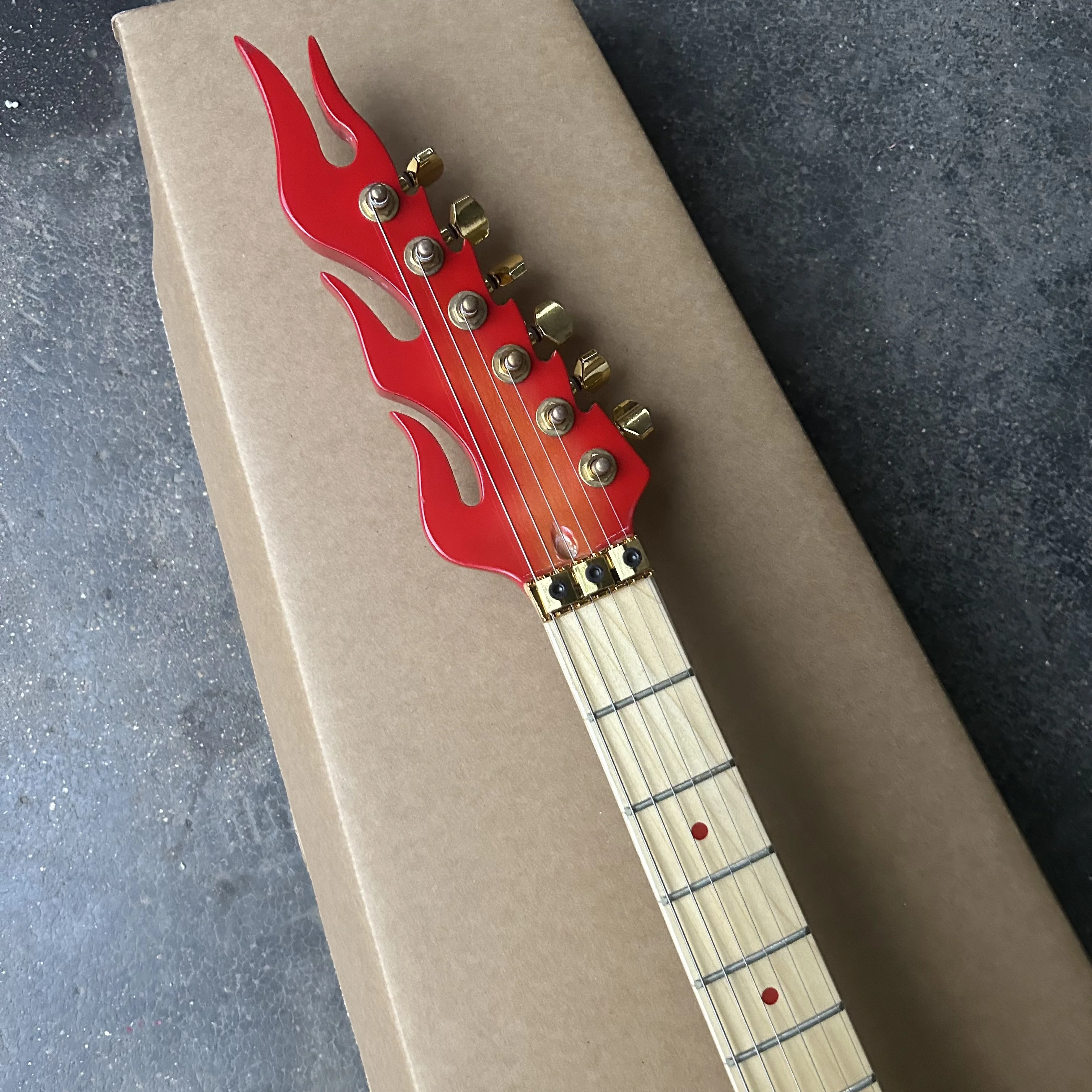 Inventory, new flame electric guitars, tiger patterned piano