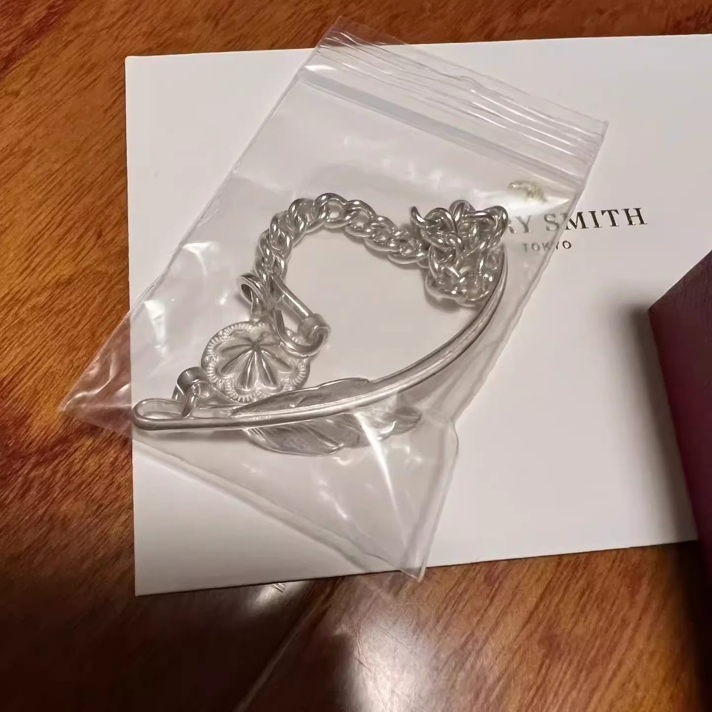 Larry sm1th wind cut feather bracelet