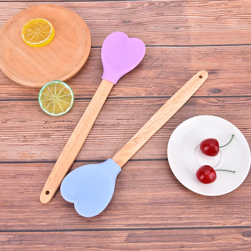 https://ae01.alicdn.com/kf/Sc756e4906ffe418c837df6eb93fbafc9e/1-Piece-28cm-Cute-Silicone-Heart-Pastry-Easy-and-Quick-Spatula-Wooden-Handle-Cookie-Scoop-Baking.jpg