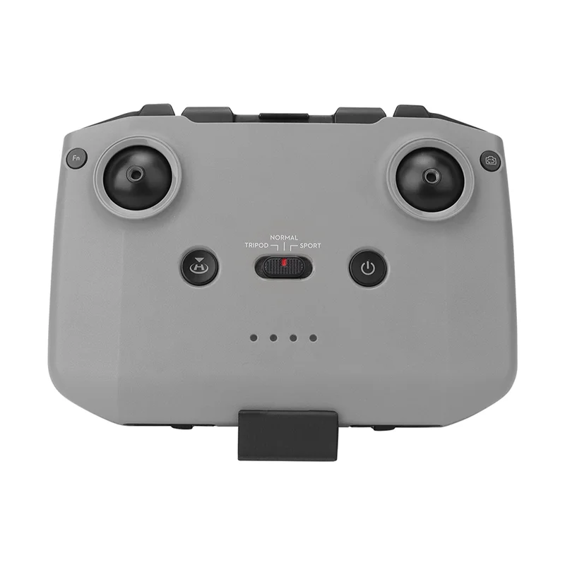 Base d'exposition pour télécommande RC en noir, support drone universel visible en arrière-plan.