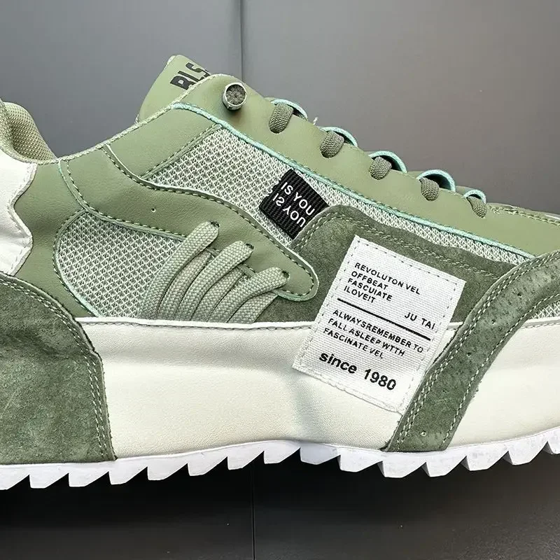 The middle of white and green summer sneakers