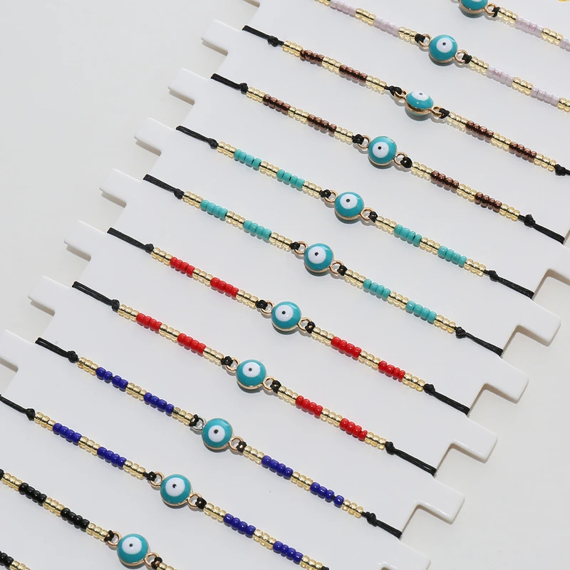 Conjunto de pulsera trenzada con cuentas de arroz para mujer y niño, pulsera de cuerda ajustable con ojos azules claros, regalos de joyería, 12 Uds./lote