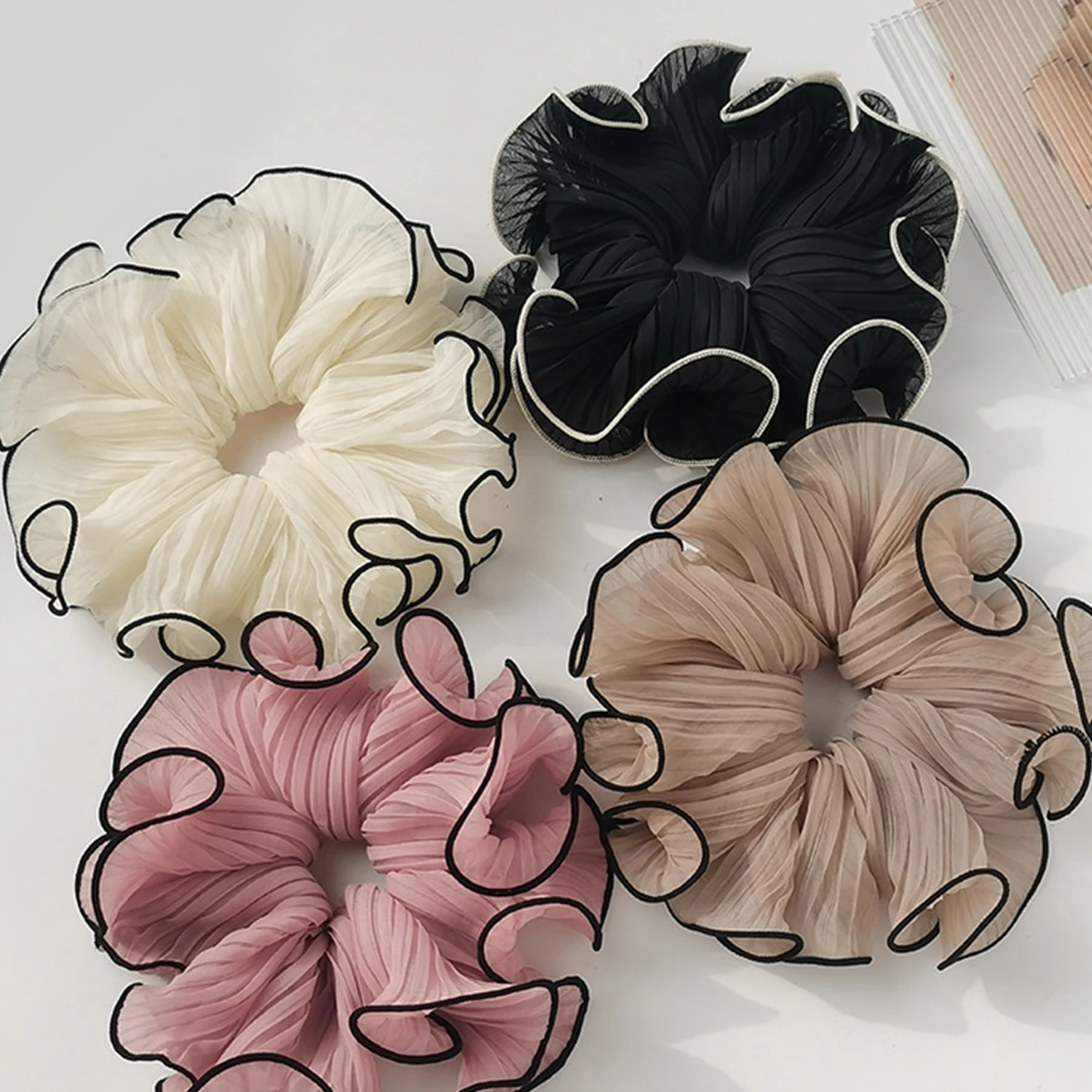 Large hair ties in trendy Korean style for girls in pink and white for hairstyles and hair accessories for women and head coverings.