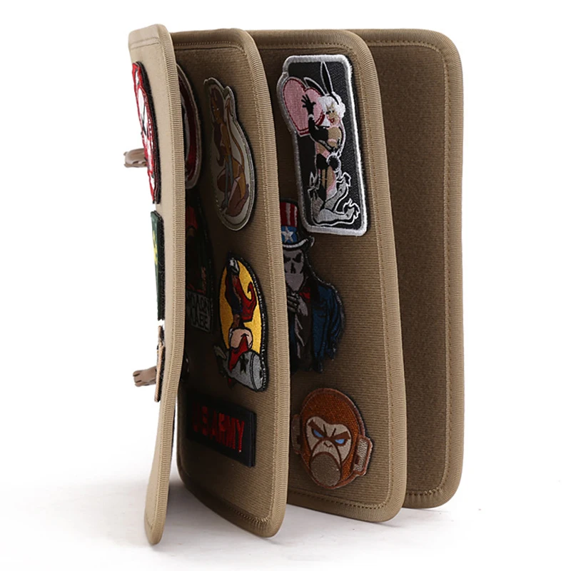 Tan Tactical patch display panel standing up with various patches on a white background