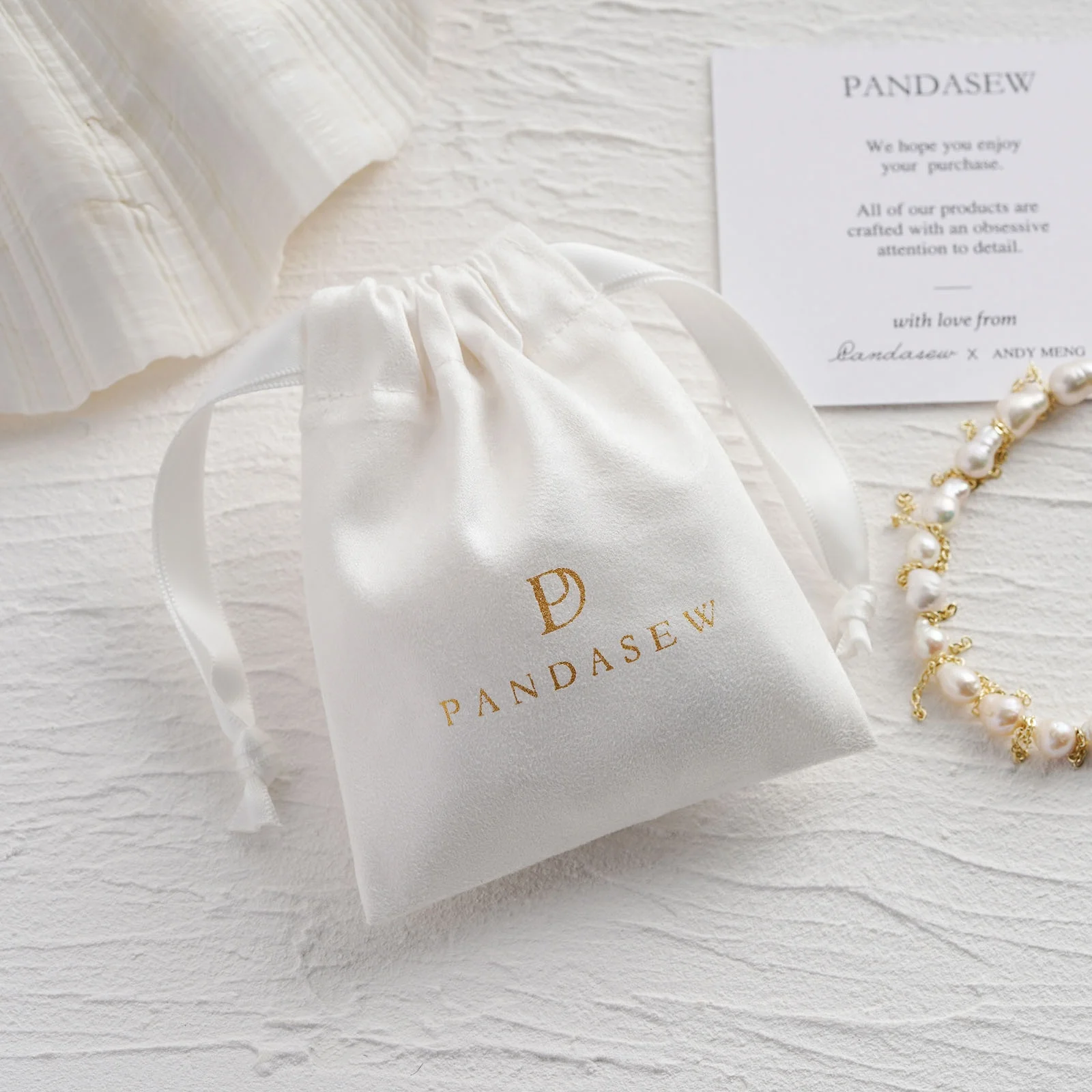 

50PCS Custom Logo Luxury Suede Drawstring Package Jewelry Bag with White Ribbons Jewelry Pouch