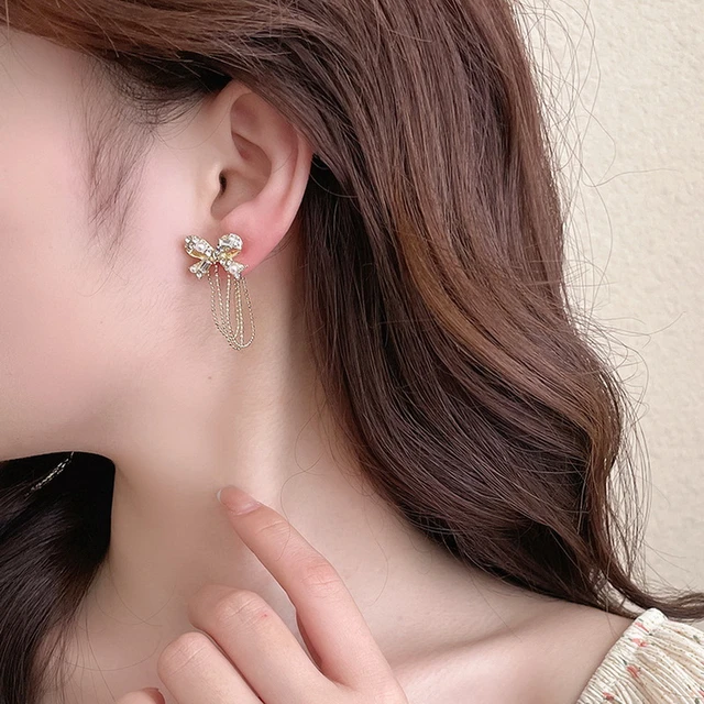 Aggregate more than 119 bow cuff earrings with chain