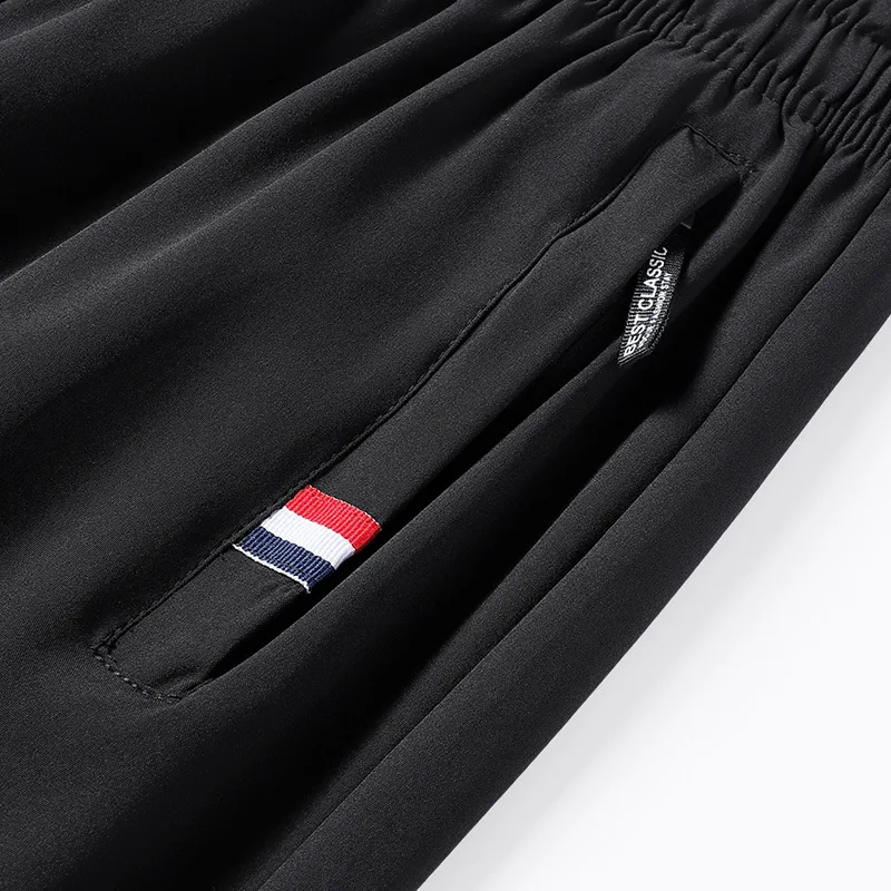Spring and Autumn Men\'s Elastic Belt High Waist Solid Color Drawstring Panel Contrast Pocket Harun Nine Point Trousers Pants